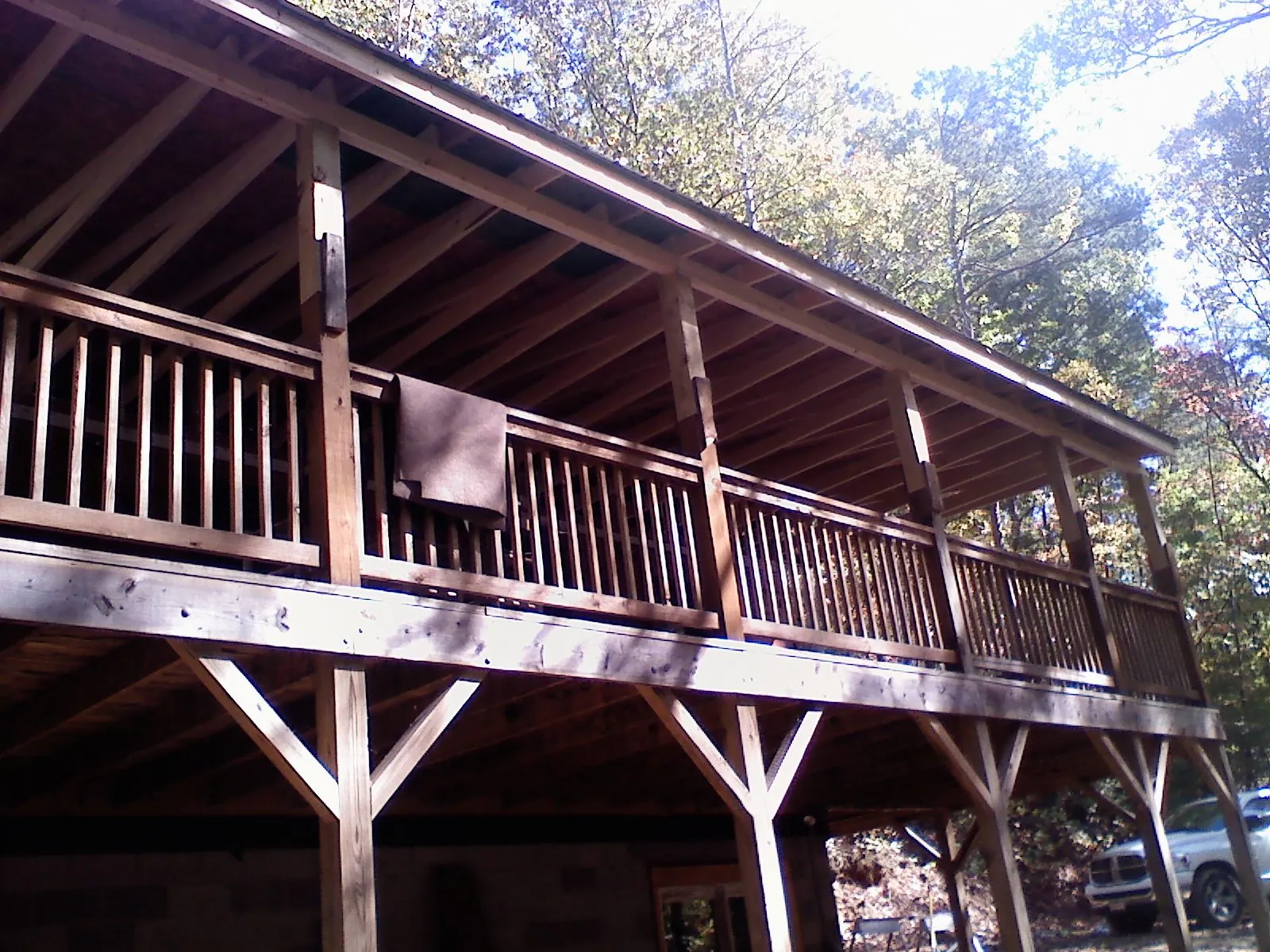 Timber framing under a new elevated porch and deck — Roof Leak Repair in Ayer by Roofing Brothers